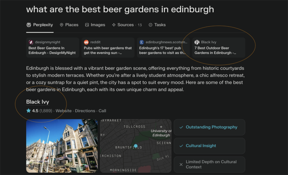 Exterior view of Black Ivy, a historic building housing a popular beer garden in Edinburgh with outdoor seating under blue sky