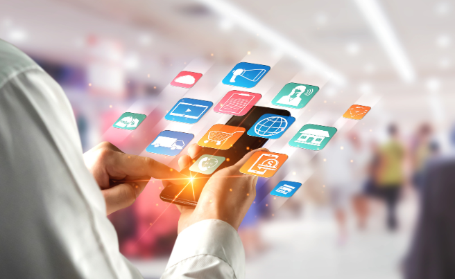 Hands using a smartphone with floating digital icons representing various apps and services in a blurred public space