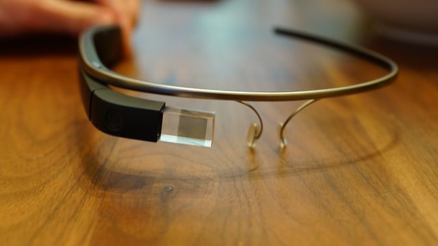 Google Glass - Explorer Edition Close-up of Google Glass Explorer Edition smart glasses on a wooden surface
