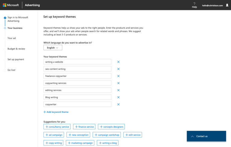 Microsoft Advertising platform interface showing the setup page for keyword themes including sample keywords entered and suggestions for additional keywords