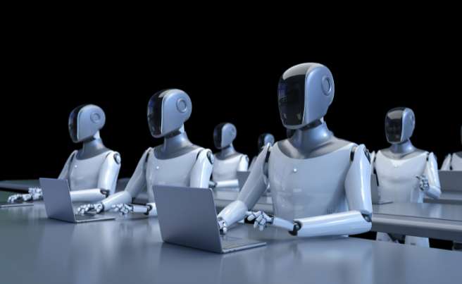 Robots seated at desks using laptops, symbolising AI involvement in online content creation
