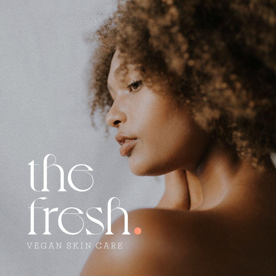 Profile of a woman with curly hair and clear skin alongside The Fresh vegan skin care logo