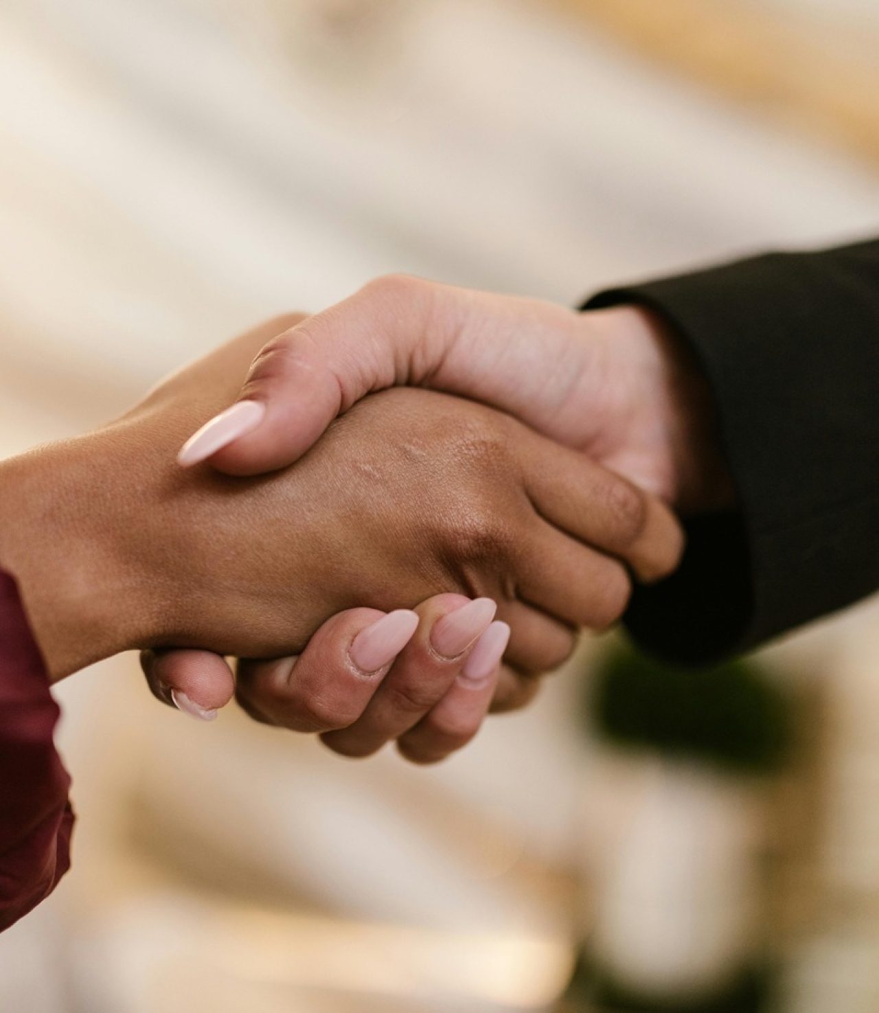 Close-up of two people shaking hands, symbolising business partnership and trust