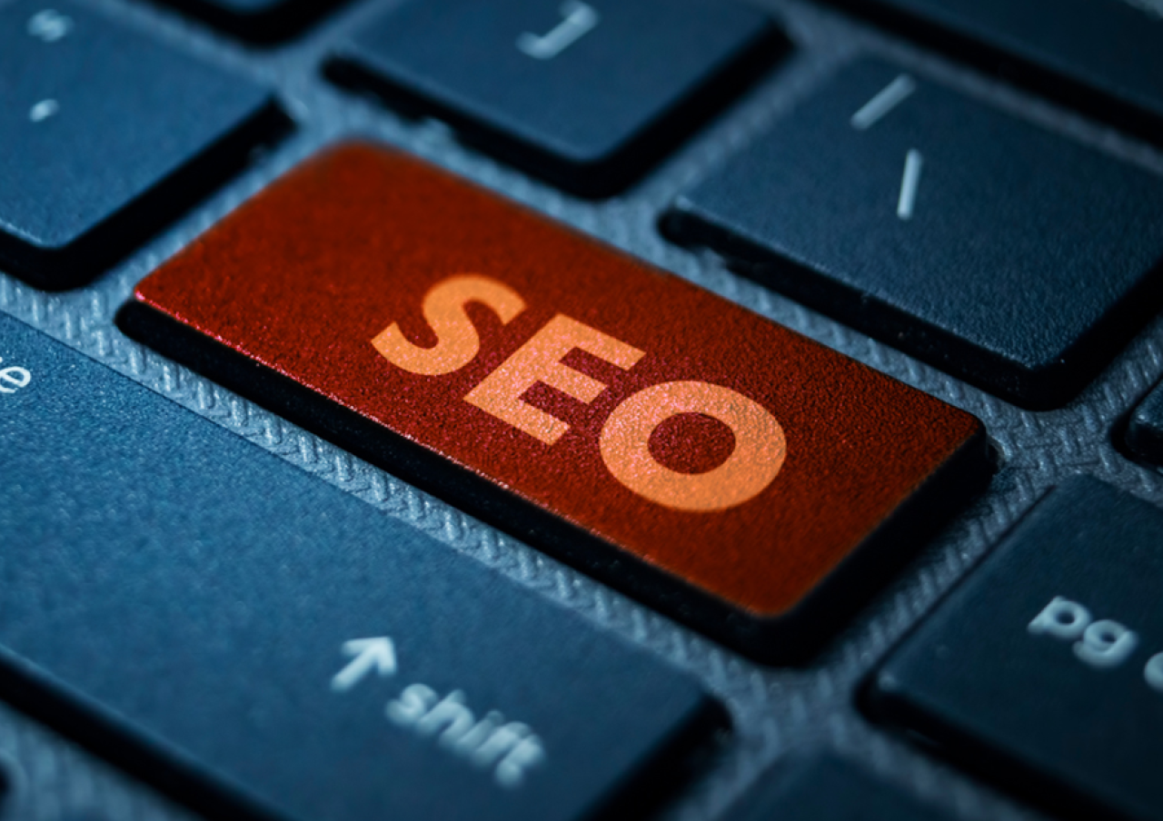 Close-up of a keyboard with a red key labelled SEO next to the shift key