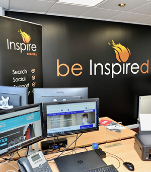 Interior view of Inspire Digital Perth office in 2014 showing branded wall and computer workstations