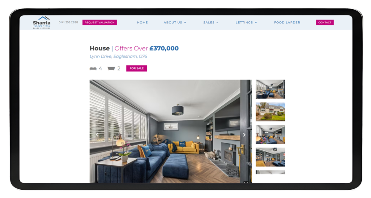 Tablet screen showing Shanta Residential property listing with living room images, price, address and navigation menu
