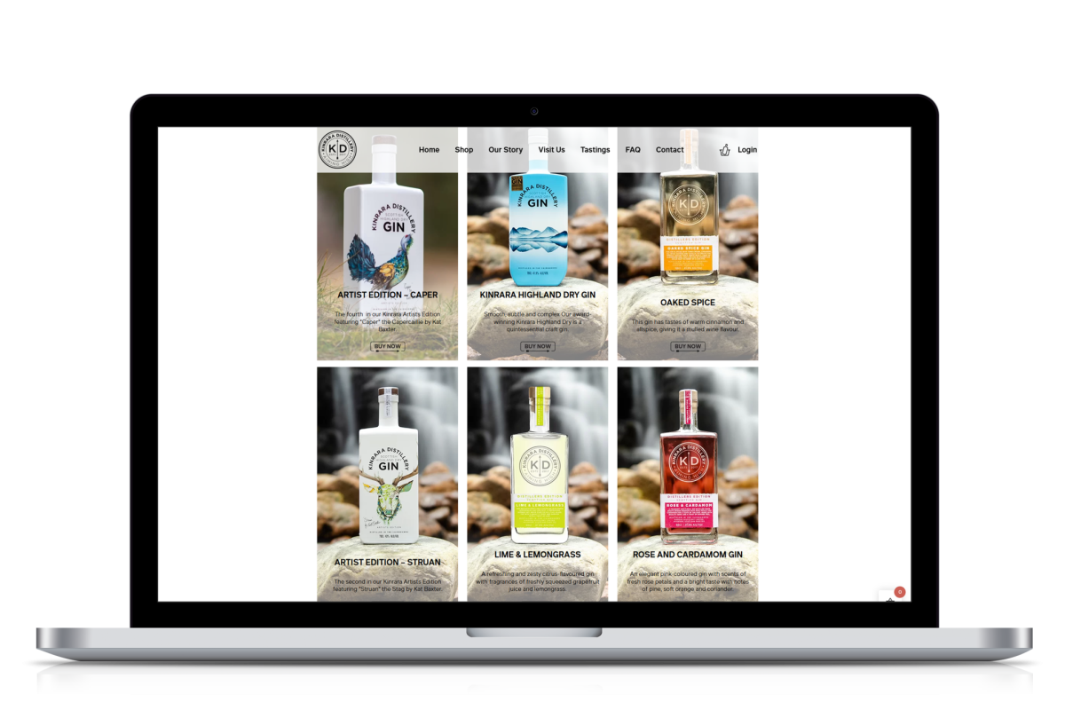 Laptop screen showing Kinrara Distillery eCommerce website with six craft gin bottles and their descriptions arranged in a grid