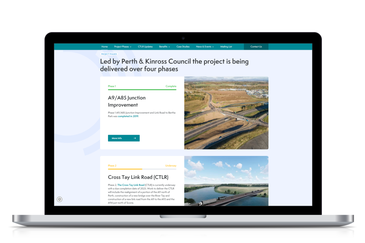 Laptop displaying Perth Transport Futures website showing project phases including completed A9/A85 Junction Improvement and ongoing Cross Tay Link Road