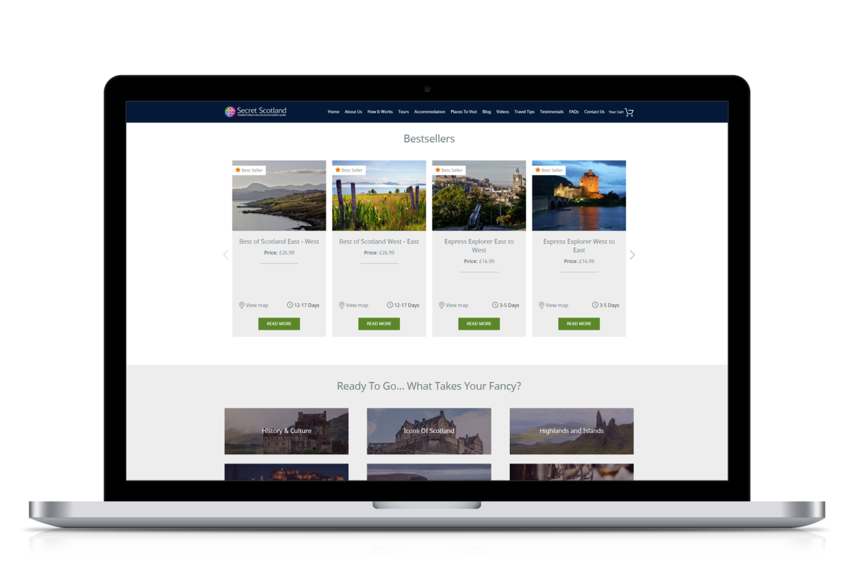 Laptop displaying Secret Scotland website with bestselling self-drive tour itineraries and scenic images of Scotland