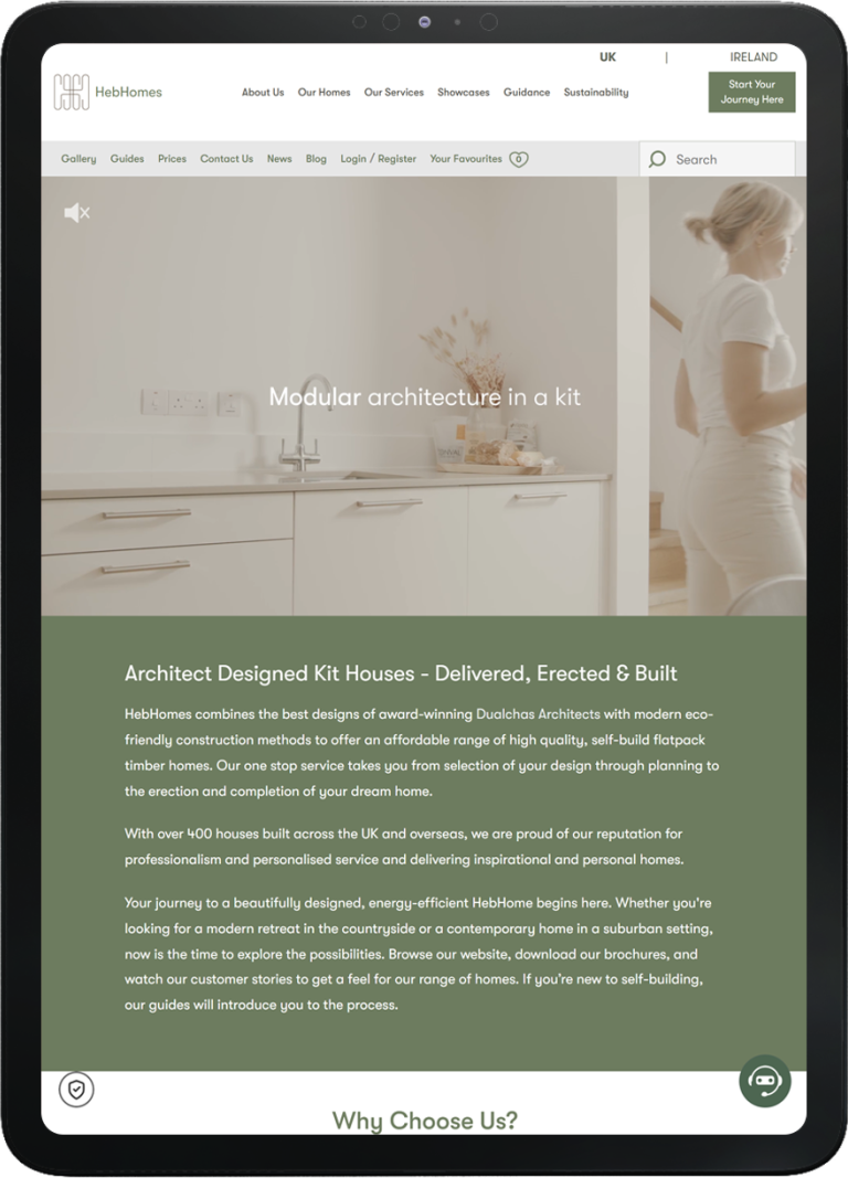 Tablet screen showing Heb Homes website homepage featuring modern kitchen and navigation menu