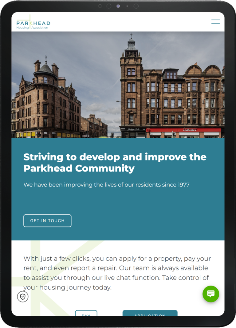 Tablet showing Parkhead Housing Association website homepage with community buildings and site navigation